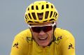 Making an effort: Christopher Froome of Great Britain riding for Team Sky crosses the finish line during stage 12 of the ...