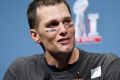 Playing a dangerous game: New England Patriots quarterback Tom Brady.
