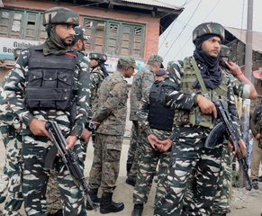 Indian security force personnel stand guard at the site of a militant attack in Batengo village, around 40 kilometers south of Srinagar, the summer capital of Indian Kashmir, 11 July 2017. According to reports, seven Amarnath pilgrims were killed and 19 injured in a suspected militant attack in Batengo area of Anantnag. The pilgrims were returning from the Hindu pilgrimage cave shrine of Amarnath in the Himalayas on 10 July 2017 evening.