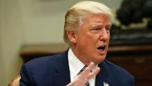 President Donald Trump speak to members of the media before having lunch with services members in the Roosevelt Room of ...