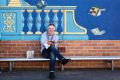 French mural artist Hugues Sineux with his latest work at Epping Heights Public School.