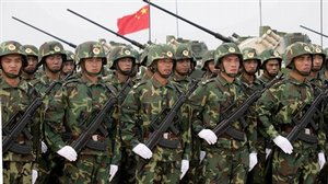 Chinese troops line up in front of their tanks in Qingdao, in east China's Shangdong Province, Monday, Aug. 22, 2005 during "Peace Mission 2005" Sino-Russian joint military exercise. A 9,000-strong force of Chinese and Russian troops taking part in their first joint military exercises is preparing for live-fire drills on China's east coast, state media said