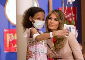 A small child takes a selfie with Melania Trump, the wife of US President Donald Trump, at the Queen Fabiola Childrens Hospital in Brussels on Thursday, May 25, 2017. Melanie Trump visited children in a ward at the hospital on Thursday and participated in a crepe paper flower making workshop.