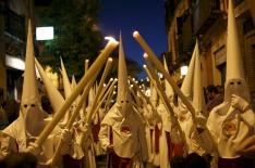 Penitents make their penance during a Holy Week procession.