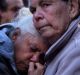 Diane Whittaker (centre) is comforted by Daisy Fernando (right). Both are aunts of Eric Whittaker who died in custody. 