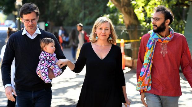 Cr Jonathan Sri accompanies Larissa Waters, her partner Jeremy Gates and daughter Alia Joy, to announce her resignation ...