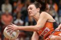 Back in orange: Bec Bulley of the Giants wins the ball under pressure from Shae Brown of the Magpies during the Super ...