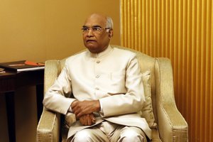 Bihar Governor Ram Nath Kovind, sits after his arrival at the airport in New Delhi, India, Monday, June 19, 2017.