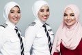 AirAsia pilots wearing the new hijab with designer Neelofa.