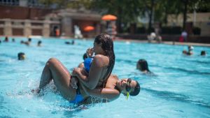 Teenagers cool off at the Hamilton Fish pool, Tuesday, July 18, 2017, in the Lower East Side neighborhood of Manhattan. ...