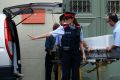 Workers bring a coffin containing the embalmed body of Dali to the Dali Theater Museum in Figueres in northern Spain on ...