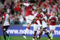 Delight: Mohamed Elneny celebrates his goal at ANZ Stadium.