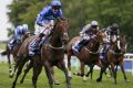 Maiden group 1 win: Adam Kirby steers Harry's Angel (left) to victory in The Darley July Cup Stakes at Newmarket.