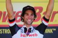 Michael Matthews celebrates on the podium after the sixteenth stage of the Tour de France.