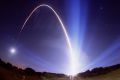 The path of a Delta rocket is shown in a time exposure as it lifts off from Cape Canaveral, Florida, carrying NASA's ...