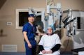 Dr Ronald Chin with patient Brian Hodge who was spared six months of recovery and disfiguring scars following robotic ...