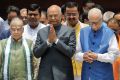 India's new president Ram Nath Kovind, centre, is flanked by senior Bharatiya Janata Party leaders M.M. Joshi, left, and ...