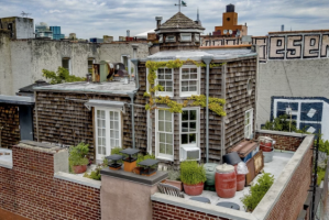 With its weathered shingles, bucolic cupola, and inviting wrap around terrace, it's hard to resist the charm of a ...