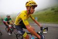 Chris Froome holds a slender lead in the Tour de France