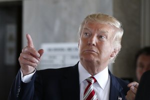 HOLD FOR STORY - FILE – In this Aug. 16, 2016, file photo, Republican presidential candidate Donald Trump gestures during a campaign stop at the Milwaukee County War Memorial Center in Milwaukee, Wis.