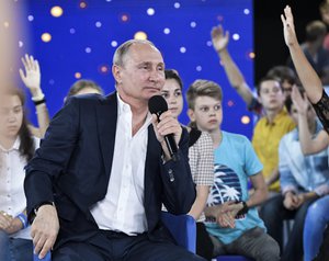 Russian President Vladimir Putin speaks to the students while visiting the Sirius Educational Centre for Gifted Children in the Black Sea resort of Sochi, Russia, Friday, July 21, 2017.