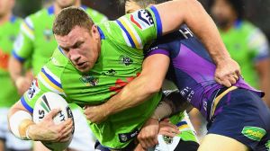 Shannon Boyd of the Raiders is tackled by Cooper Cronk.