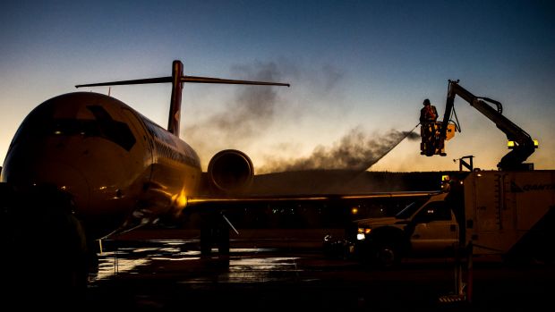 De-iceing work on the Qantas aircraft at Canberra airport in sub-zero temperatures.