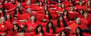 Hundreds of people put on red dresses for Melbourne's Most Wuthering Heights Day Ever in Edinburgh Gardens.