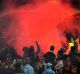 A flare is set off during the match between Adelaide and Geelong on Friday night.