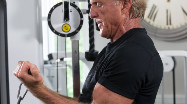 Greg Norman works out everyday. His sessions include three sets of cable bicep curls, 12 reps each.