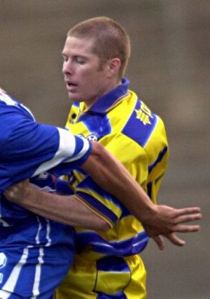 Jeromy Harris (right) playing for the Brisbane Strikers against Sydney Olympic at Suncorp Stadium in 2000.