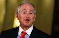 Steve Schwarzman, who leads the President Donald Trump's Strategic and Policy Forum, answers questions at a news ...