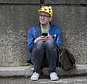 Ryan Copple of Los Angeles sits in the shade as he struggles to play Pokemon Go at the Pokemon Go Fest Saturday, July 22, 2017, at Grant Park in Chicago. Many festival attendees had trouble getting the augmented-reality cellphone game to work. By the afternoon, Mike Quigley, chief marketing officer of the game's developer, Niantic, announced all ticket holders would receive refunds and be issued $100 in credits for use in the app. Copple came to Chicago from Los Angeles just for the event. (Erin Hooley/Chicago Tribune via AP)