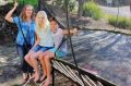 Vivienne Pearson and her two children, with the trampoline that cost them more than $4000, including accessories and ...