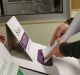 NCH NEWS. 2016 Federal Election. Pic shows a late voter placing her Senate ballot paper in the ballot box at Salt Ash ...