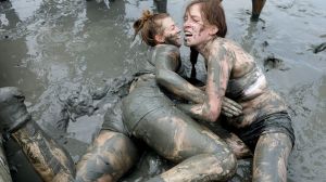 BORYEONG, SOUTH KOREA - JULY 22: Festival-goers enjoy the mud during the annual Boryeong Mud Festival at Daecheon Beach ...