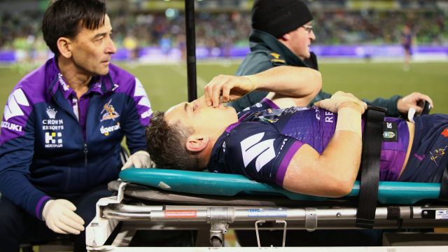 Awful sight: A concussed Billy Slater is assisted from the field.