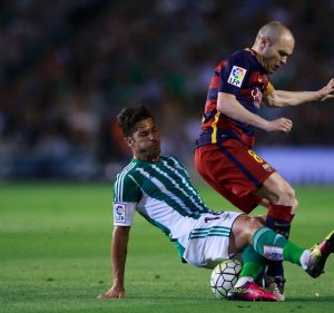 Top class: Western Sydney Wanderers signing Alvaro Cejudo tackles FC Barcelona's Andres Iniesta.