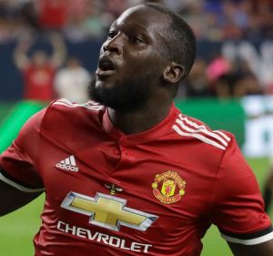 New kid: Manchester United's Romelu Lukaku reacts to scoring a goal against Manchester City during the first half of an ...