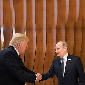 HAMBURG, GERMANY - JULY 07: In this photo provided by the German Government Press Office (BPA) Donald Trump, President of the USA (left), meets Vladimir Putin, President of Russia (right), at the opening of the G20 summit on July 7, 2017 in Hamburg, Germany. The G20 group of nations are meeting July 7-8 and major topics will include climate change and migration.  (Steffen Kugler/BPA/Getty Images)