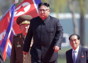 FILE - In this April 13, 2017 file photo, North Korean leader Kim Jong Un, center, is accompanied by Pak Pong Ju, right, Hwang Pyong So, second left, as he arrives for the official opening of the Ryomyong residential area, in Pyongyang, North Korea.