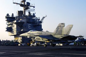 An F/A-18C Hornet attached to the Thunderbolts of Marine Fighter Attack Squadron (VMFA) 251, makes an arrested landing on the flight deck aboard the nuclear-powered aircraft carrier USS Enterprise (CVN 65).