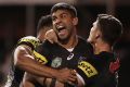 Tyrone Peachey, of the Panthers, celebrates with teammates Waqa Blake and Nathan Cleary after their last-minute win over ...