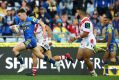 In the clear: Clint Gutherson sprints away to score one of his two tries.