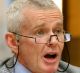 One Nation Senator Malcolm Roberts puts questions to Chief Scientist Dr Alan Finkel during a Senate Estimates hearing at ...