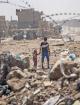 Children walk through the ruins of their neighborhood in Mosul (European Commission DG ECHO | flickr)