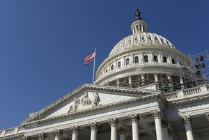 In this Tuesday, Sept. 6, 2016, file photo, an American flag flies over Capitol Hill in Washington.