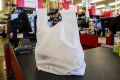 Coles, Woolworths and Harris Farm produce about 80 per cent of the plastic bags in NSW, the Premier says.