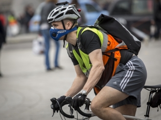 A cyclist wearing an anti-pollution mask  in London