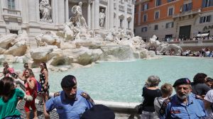 Volunteers control the flow of visitors to the Trevi Fountain in Rome this week.